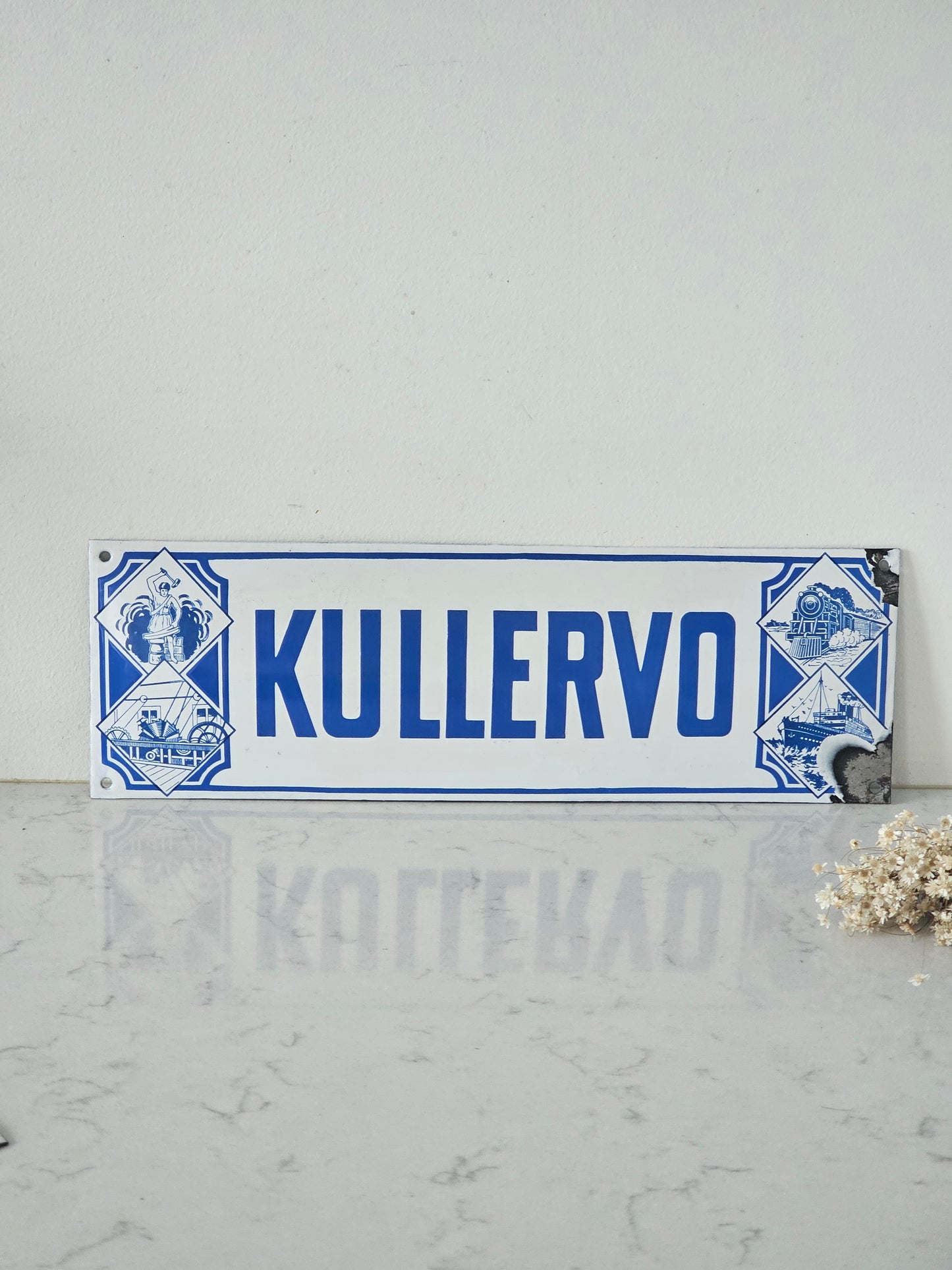 Pohjola, Kullervo ja tapaturmavakuutuksia vanha emalikyltti