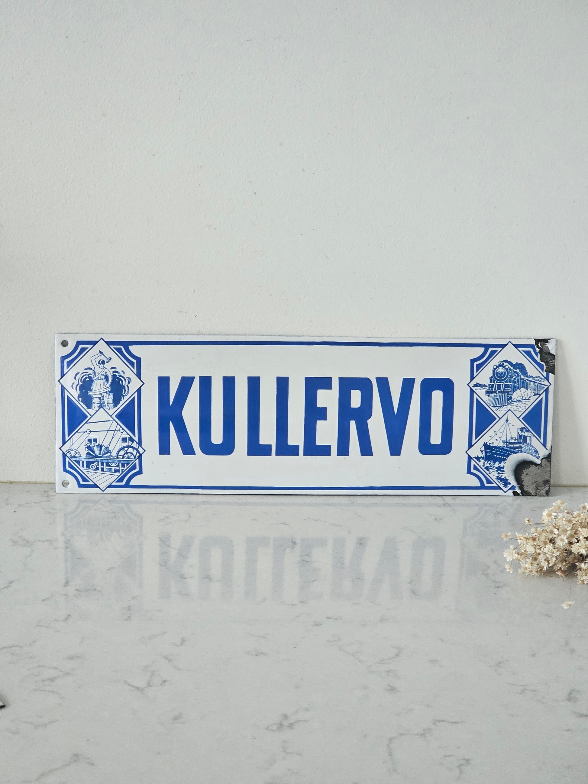 Pohjola, Kullervo ja tapaturmavakuutuksia vanha emalikyltti