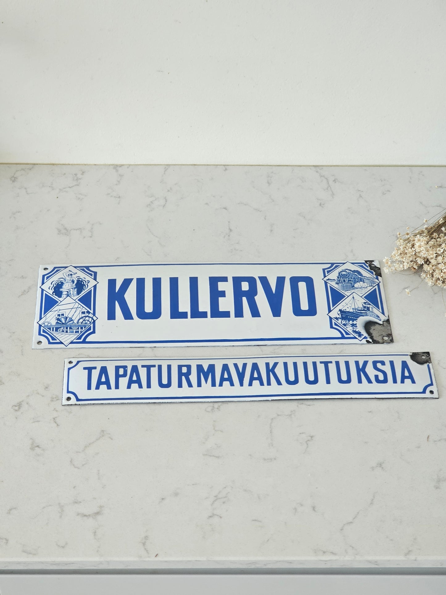 Pohjola, Kullervo ja tapaturmavakuutuksia vanha emalikyltti