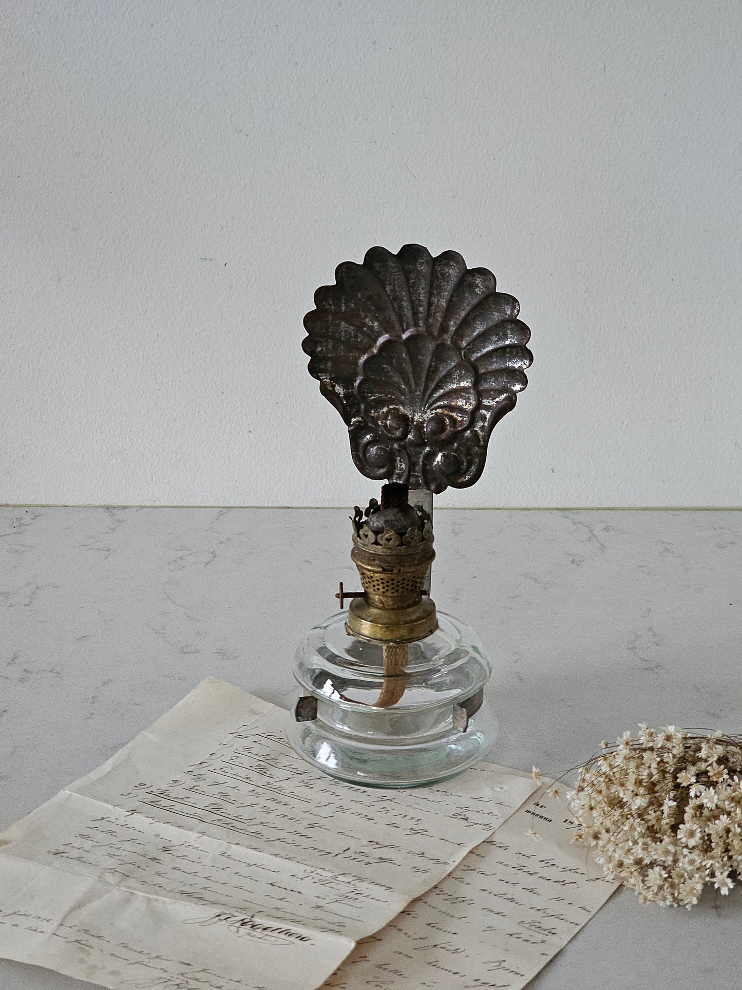 Simpukanmuotoinen öljylamppu