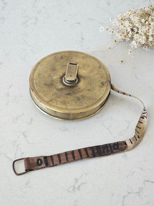 Brass tape measure